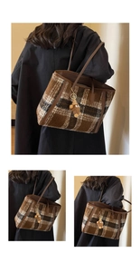 Detail of wool plaid tote bag with brown leather straps and a plush bear charm pendant