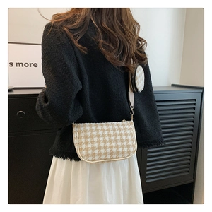 Classic houndstooth crossbody bag for women shown as a stylish shoulder bag with mini pouch