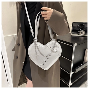 White heart-shaped punk crossbody bag with silver chains and gothic metallic charms