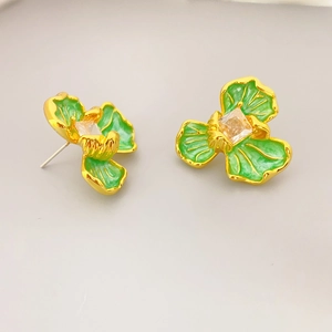 Elegant flower stud earrings with green enamel petals and a central square zircon stone