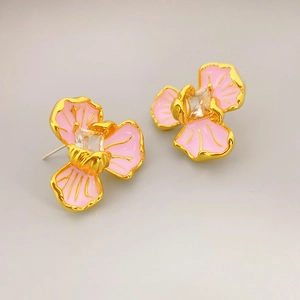 Elegant gold flower earrings with pink enamel petals and a square crystal center stone
