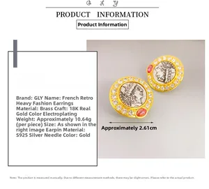 Close-up of French vintage gold earrings with portrait relief and white zircon inlay