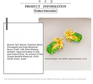 Detail view of 18K gold plated pineapple earrings with green crystals and S925 silver needles