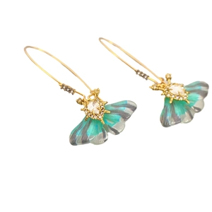 Artistic gold-plated butterfly wing earrings with green translucent gradient and crystals
