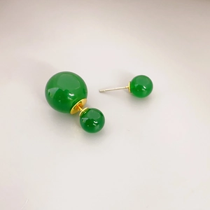 Elegant emerald green double pearl stud earrings with golden finish metal accents