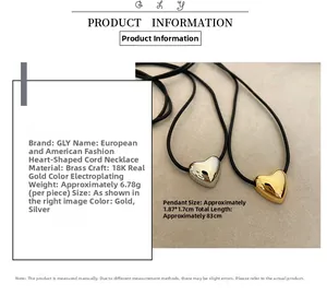 Close-up of 18K gold plated heart pendant with dimensions 1.87x1.7cm and long black cord