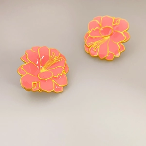 Vintage coral pink enamel flower stud earrings with gold plating and fine metallic details