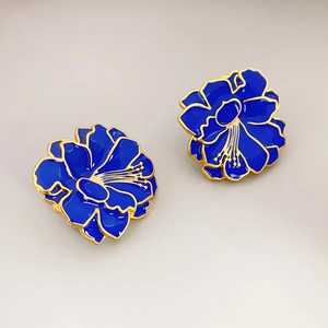 Vintage style floral stud earrings with deep blue enamel and gold-plated flower design