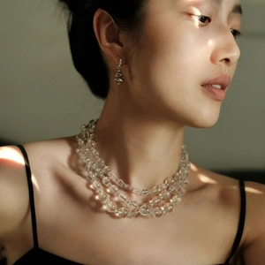 Elegant multi-layered clear crystal long necklace with silver geometric earrings for women