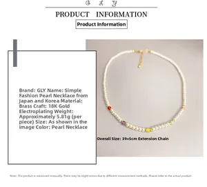Detail view of pearl and color bead necklace with 18K gold plating and 39cm dimensions