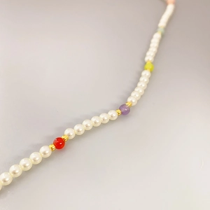 Elegant beaded pearl necklace with colorful gemstones and golden spacer beads for women