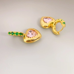 Golden heart earrings with pink gemstone and green zirconia accents on a clean background