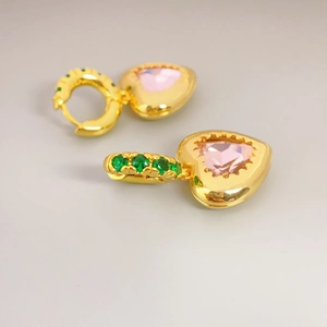 Gold heart drop earrings with pink crystal center and green stones in a luxury style