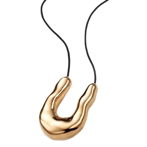 Elegant gold irregular U-shape pendant necklace with minimalist black cord on white background