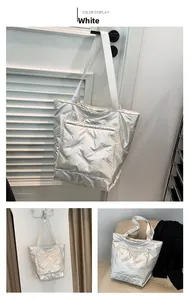 Detail of silver quilted bucket bag featuring large capacity and waterproof fabric