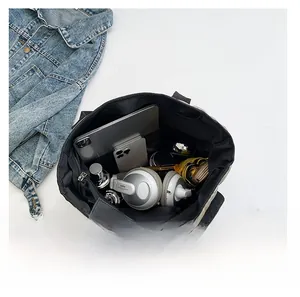 Top-down view of a spacious quilted tote bag showing large interior capacity for essentials