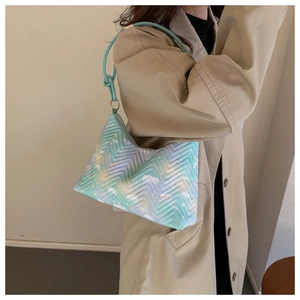 Close-up of quilted nylon bag featuring colorful pastel gradient and fairy tale patterns