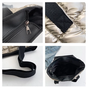 Detail view of champagne gold quilted tote bag with metal zipper and woven straps
