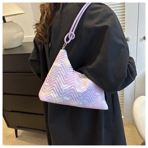 Detail of lavender gradient nylon bag with butterfly prints and zigzag quilting detail