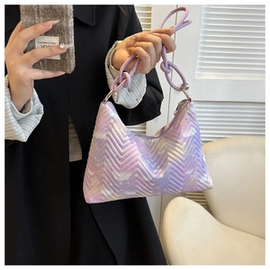Close-up of purple quilted hobo bag featuring butterfly prints and knotted shoulder strap