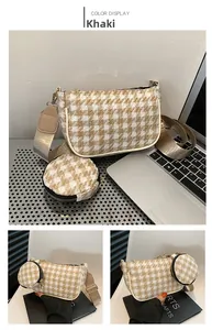 Detail of khaki houndstooth pattern bag set with matching round coin purse and wide strap