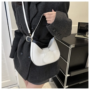 White half-moon shoulder bag with heart LOVE embossed flap and thin leather strap