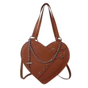 Dark brown heart-shaped crossbody bag with silver chains, rivets and cross pendant