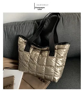 Detailed macro view of champagne quilted tote bag with metallic nylon texture