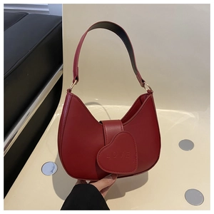 Red heart-shaped crescent shoulder bag in smooth PU leather with LOVE engraving