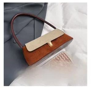 Size comparison between the textured contrast underarm bag and a smartphone