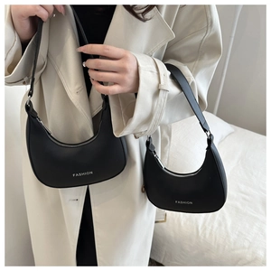 Size comparison of two black leather crescent shoulder bags with white FASHION logo