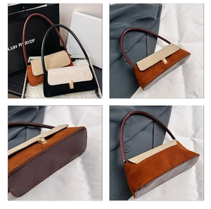 Close-up of contrast color corduroy underarm bag with retro gold square buckle hardware