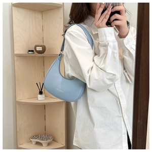 Minimalist light blue hobo bag with Fashion logo and crescent shape design for women