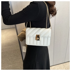 White quilted chain shoulder bag for women with gold twist lock and V-stitch pattern
