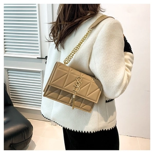 Quilted nylon tote bag in apricot with gold chain strap and geometric stitch pattern