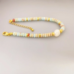 Handmade beaded bracelet with blue stone pearls and golden adjustable chain fastener