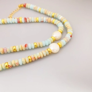 Bohemian multicolored stone beaded necklace with white pearls and gold metal accents