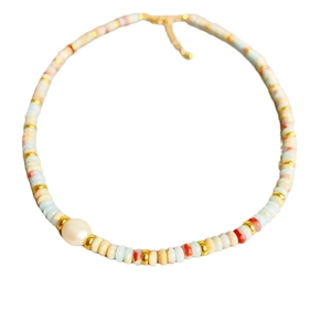 Handmade beaded necklace with colorful discs, golden beads and large white pearl focal point