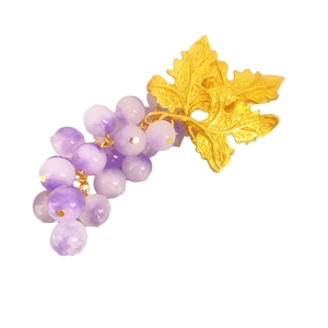 Vintage grape cluster earrings with purple beads and gold leaf details on white base