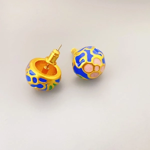 Vintage style gold hemisphere earrings with colorful enamel glaze and geometric patterns