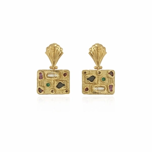 Detailed shot of vintage gold earrings with textured surface and colorful gemstones