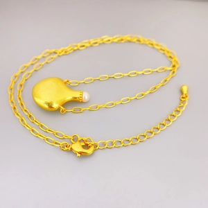 Fashionable gold perfume bottle pendant necklace with pearl on a classic cable chain