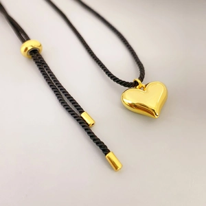Polished heart pendant necklace with adjustable black woven rope for women