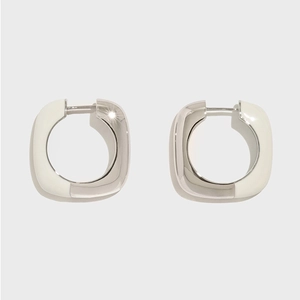 Detail of silver square hoop earrings with white enamel finish and snap closure