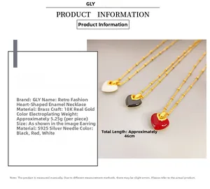 Detail of 18K gold plated brass heart enamel pendant necklaces in white, black and red