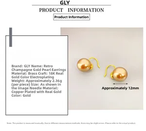 Detail of 12mm champagne gold pearl earrings with 18K gold-plated brass hooks