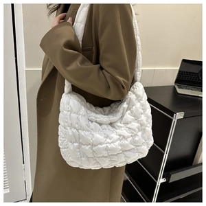Minimalist white quilted cloud bag for women made of lightweight nylon with a wide shoulder strap