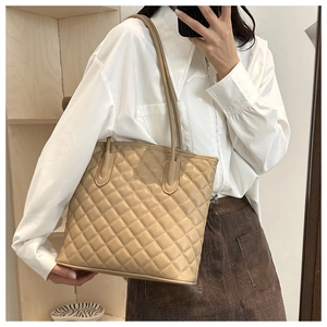 Minimalist beige quilted diamond leather tote bag with long dual shoulder straps