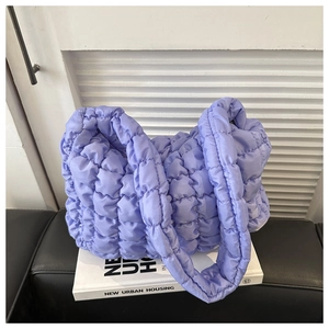 Detailed view of lavender quilted bubble texture on soft nylon fabric hobo shoulder bag