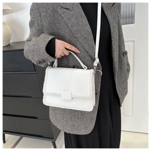 White faux fur trim shoulder bag in minimalist chic style with adjustable strap